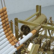 Kristoffer Myskja, Smoking machine 2007 cigarettes, various metals, filament, motor, 23 x 15 x 20 cm