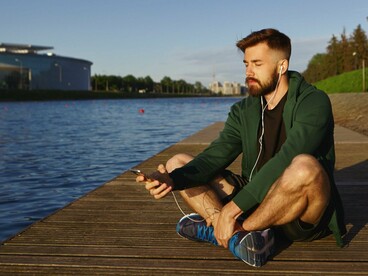 A man taking time to simply be present, symbolizing a healthier relationship with time and attention
