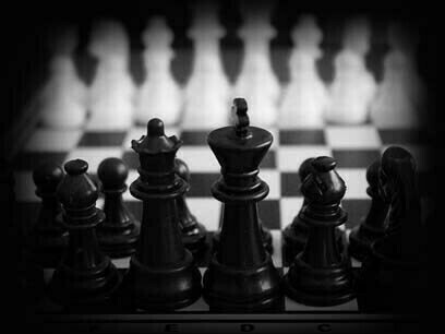 Chess pieces represent the challenges faced by humanity in the form of moral and ethical dilemmas in war and conflict