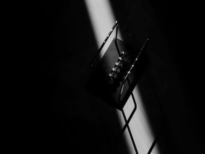 The rhythmic clacking of Newton's cradle demonstrates the principle that the total momentum of the system remains constant unless acted upon by an external force