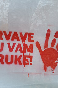 Red handprints with You have blood on your hands!, Serbian: Krvave su vam ruke!, Belgrade, Serbia