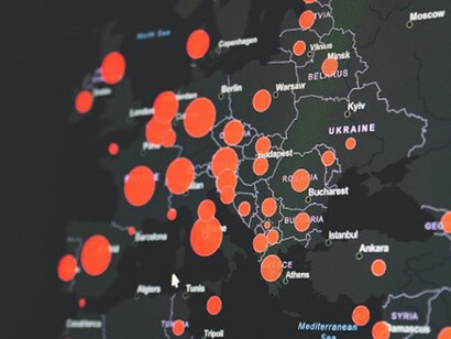 The pandemic's toll is vividly portrayed on the world map, with striking hues of red and black representing the widespread impact felt across nations