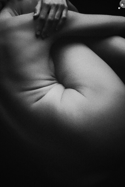 Grayscale photography of the naked human form can powerfully highlight body image issues, especially in the context of unrealistic beauty standards promoted on social media