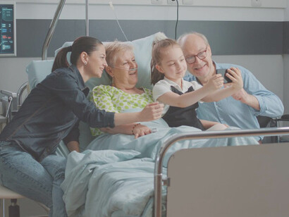 A niece embraces her sick aunt during a family visit in the hospital ward, as they bid farewell before euthanasia