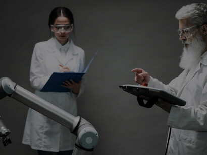 A woman and man engaged in robotic technology research in a lab, demonstrating advanced technological innovation