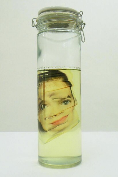 Face FSx Aborted, 2007-2013, 15 ¾ x 4 ¾ inches, 40 x 12 cm diameter - glass jar, printed china, oil and image printed on rhodoïd