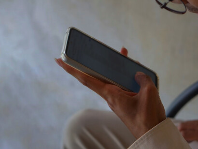 A close up of a person holding a cell phone