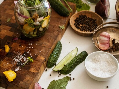 Pickled gherkins and garlic lay on the table