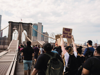 Protestors carrying signs in support of Black Lives Matters on the Brooklyn Bridge in New York, USA