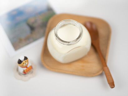 A container full of yogurt is 'solid' before you touch it