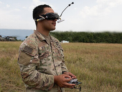 United States Army Spc. Tyler Dooros inspects a PDW C100 drone before a live demonstration at the Norio Training Area in Georgia during Agile Spirit 25 on Aug. 2, 2025. Serving with Hawkeye Platoon, Headquarters and Headquarters Troop, 1st Squadron, 91st Cavalry Regiment, 173rd Airborne Brigade, Dooros prepares the drone to demonstrate its aerial resupply and payload delivery capabilities enhanced by custom 3D-printed components