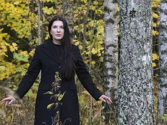 Marina in Black coat in the forest – Portrait of Marina Abramovic, © Knut Bry and Ekebergeparken Oslo, 2013