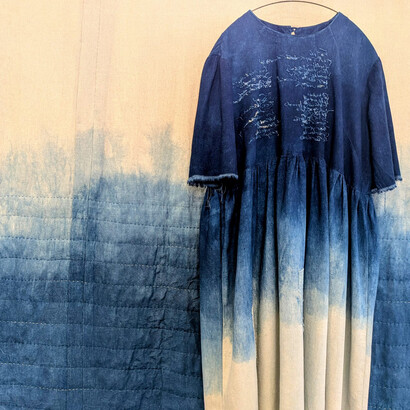 Caroline Mayers, 5am Thoughts on a long marriage. Linen quilt, dress, and cotton thread, all dyed with indigo. Brass hoop, 2025