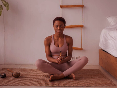 In her peaceful pose, she honours the contributions of female yoginis who have expanded yoga's reach and accessibility, integrating therapeutic and inclusive practices into the tradition