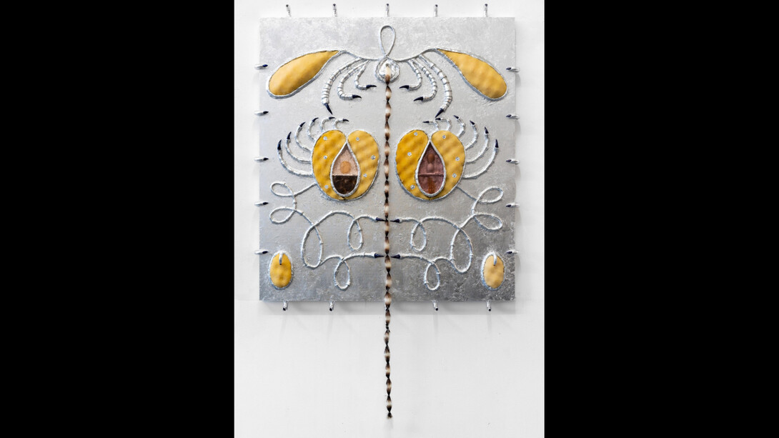 Estefania Puerta, Soltera, 2023, aluminum leaf, resin, plastic, stained glass, artist hair, quail eggs, roots, plant, nail polish, 40x36x3 inches. Courtesy the artist and Micki Meng, NYC
