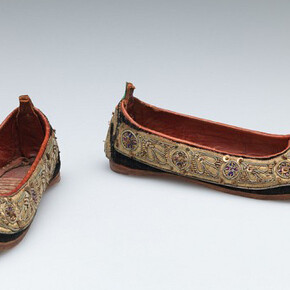 Unknown artist, Indian, Child’s shoes (juttis), late 19th Century, Silk velvet with metallic thread, metal sequin, and stamped metal embellishment, trimmed with leather, Length: 16.5 cm (6 1/2 inches) Gift of Nelson A., Laurence S. and David Rockefeller 56.068