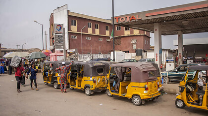 Cars are lined up at a gas station in Nigeria, waiting for petrol amid ongoing fuel scarcity