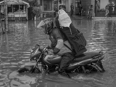 Driving through floodwaters, he reflects on the need for systemic change, pondering if catastrophe must strike before decisive action is taken