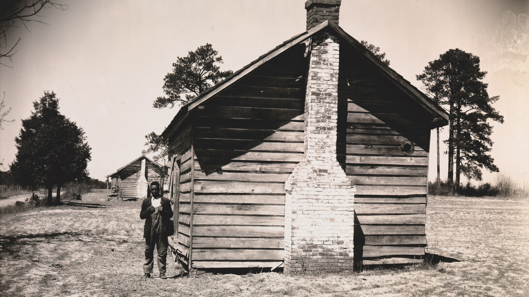 Walker Evans: Man Posing for Picture in front of Wooden House, 1936, Collection of Clark and Joan Worswick © Walker Evans Archive, The Metropolitan Museum of Art