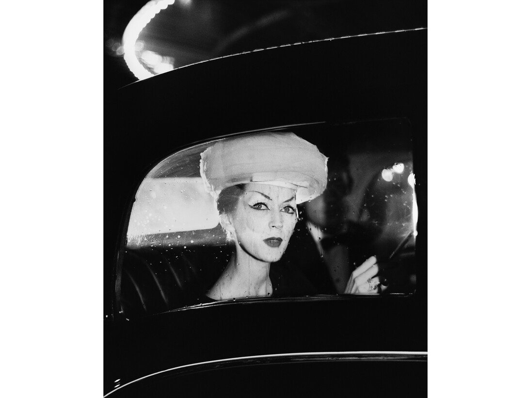 Dovima, hat by Balenciaga, Maxim's, Paris, August 4, 1955. Photograph by Richard Avedon © The Richard Avedon Foundation