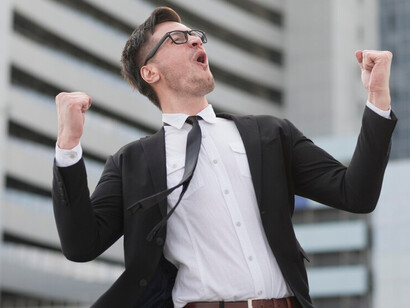 A successful businessman exudes happiness and triumph