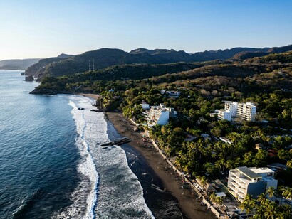 The Pacific shoreline of El Zonte Beach, El Salvador, symbolizing the natural beauty that has helped hype the nation’s international image