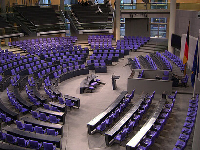 The plenary chamber of the German Bundestag, located in the Reichstag building in Berlin, Germany, serves as the central legislative space
