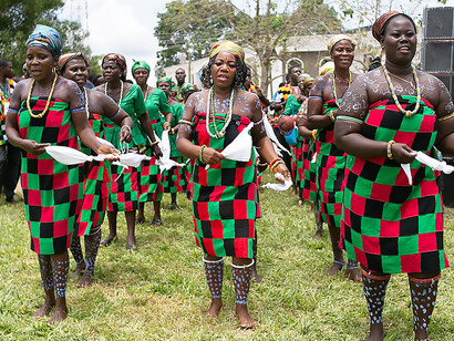 2019 Kente Festival in Ghana, women stand as living embodiments of tradition, draped in resplendent Kente cloth