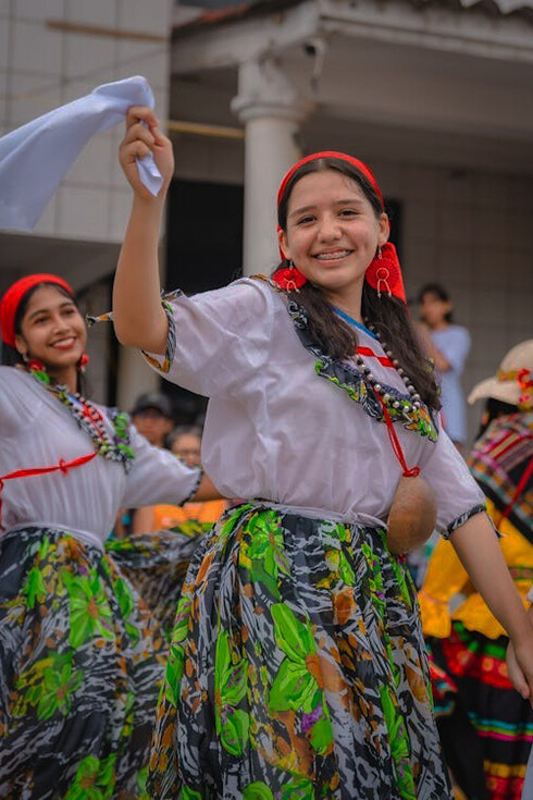 Vibrant festival scene in Rioja, Peru, featuring girls joyfully participating in the San Martín celebration, highlighting the rich cultural traditions and community spirit of the event