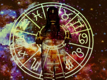 A silhouette framed by an illuminated astrological chart, reflecting the blurred line between scientific imagery and unsupported beliefs