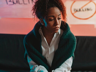 A black woman, alone, isolated, and excluded