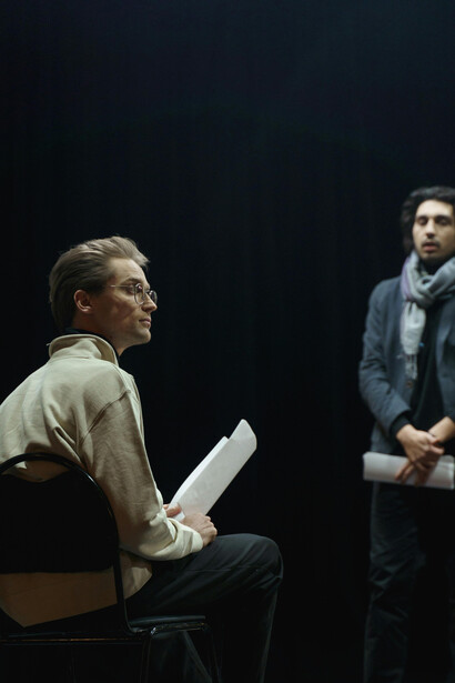 Actors preparing for the theatre, scripts in hand