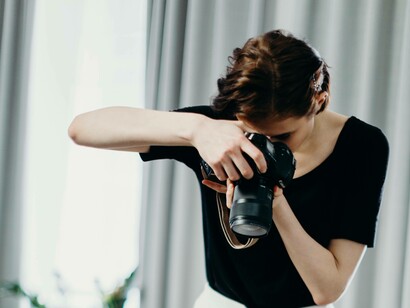 A woman snapping pictures in her way to express her creativity