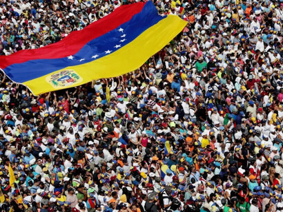 Thousands of Venezuelan citizens march in protest of their political crisis in search of freedom from the current regime