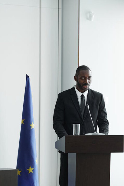 Speaker at a European Union conference, discussing foreign relations and their impacts thereof