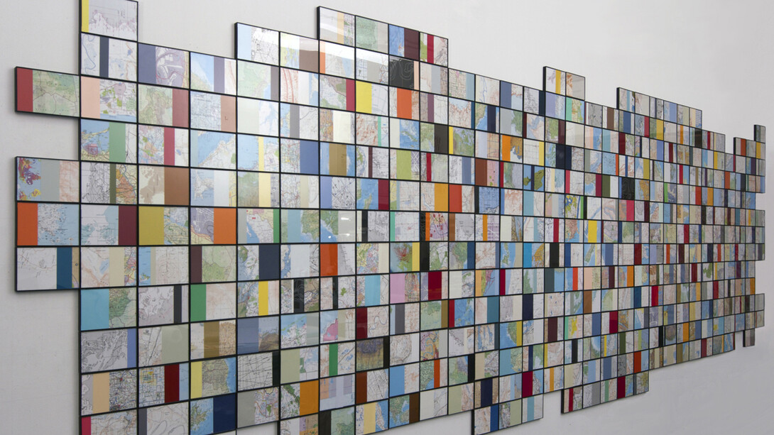 Nayda Collazo-Llorens, Geo Dis/connect, 2014, 360 framed collages with found maps, 4"x6" each, overall dimensions: approx. 5' x 16'. Courtesy of LMAKprojects, NY