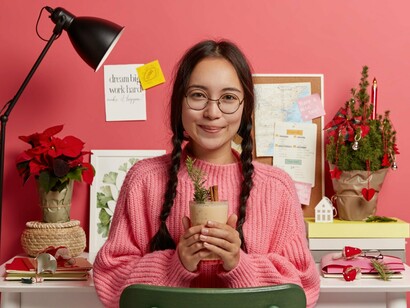 A young woman quietly enjoying her own company, representing the strength of developing an identity beyond social validation