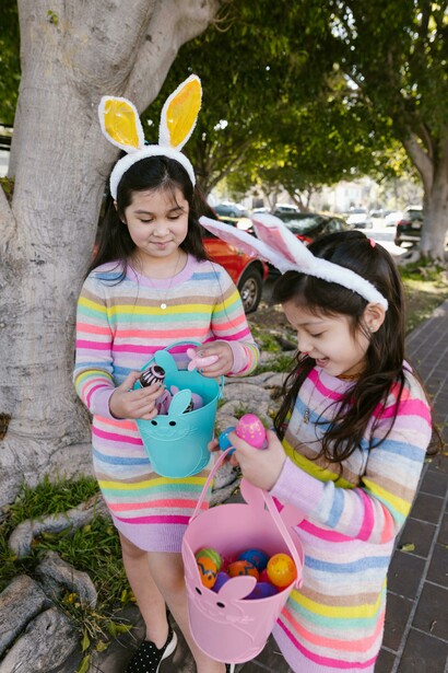 Girls walking along the street during an Easter egg hunt