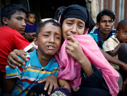 A Rohingya woman with her son