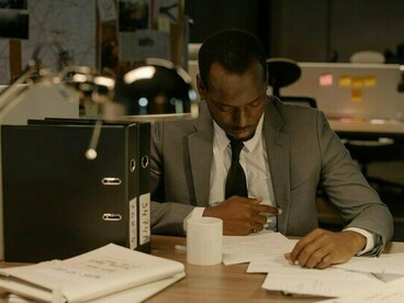 A man burdened by endless work, representing the silent struggle behind professional expectations
