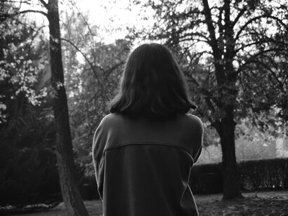 A private reckoning, standing with feelings acknowledged, but deliberately contained.