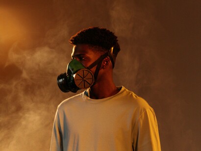 A man wearing a mask as a result of the recent climate disaster