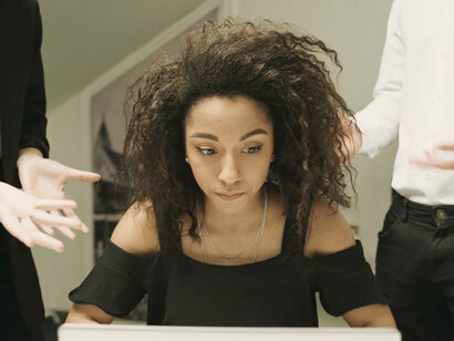 In the chaotic whirlwind of commands, a talented employee struggles to focus, highlighting the stark difference between a true leader and a bad boss