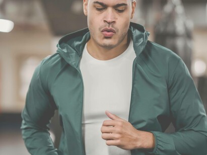 A man running on the treadmill to preserve his health and wellbeing 