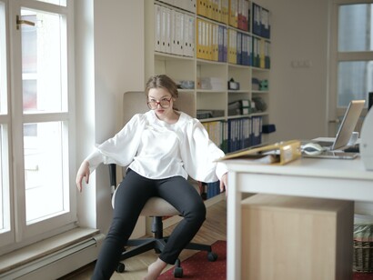 A woman demotivated on her desk, hopeless, not being positive with her attitude