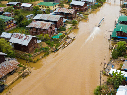 Aerial view of a flooded residential area in Myanmar, linked to climate change