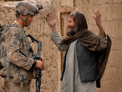 U.S. and coalition forces mentoring the Afghan National Army during a dismounted patrol