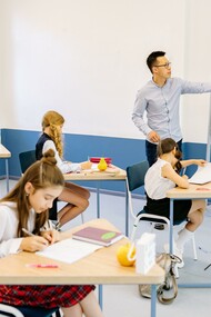 Teacher and students in a classroom; learning time