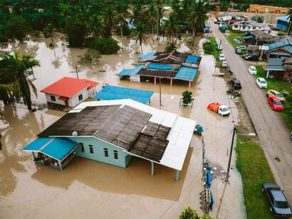 Aerial photograph of homes submerged by floods in Myanmar, highlighting climate change impacts