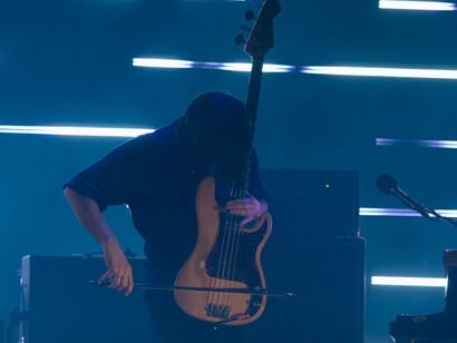 Using a bow to play the bass lets the strings vibrate continuously, producing a sustained, haunting tone instead of short, percussive notes